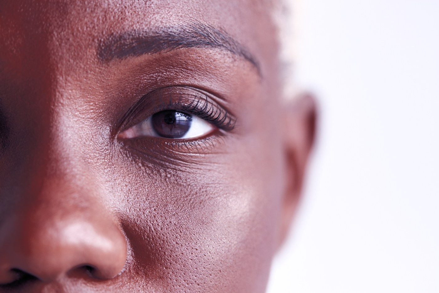 Close-up portrait of a community member in sunlight